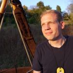 Man smiling, outdoors, digital workforce.