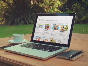 Laptop displaying online magazine.