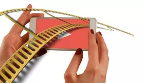 Hands holding phone, interactive mobile video.