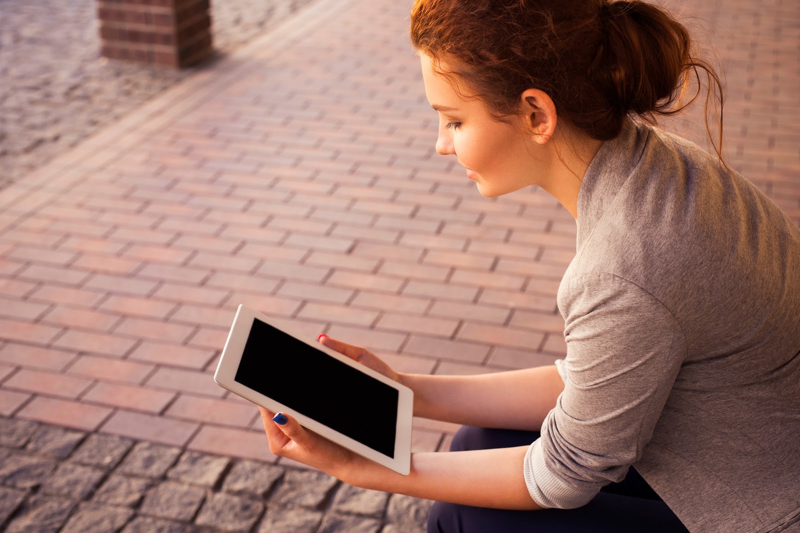 Woman using tablet, email marketing.
