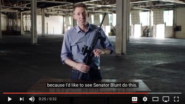 Man holding gun, reason given.