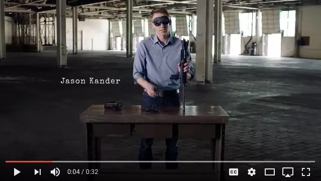 Man with blindfold, rifle.