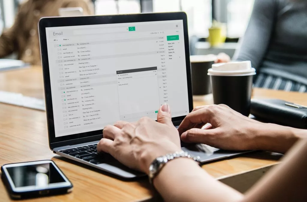 Laptop open to email inbox.