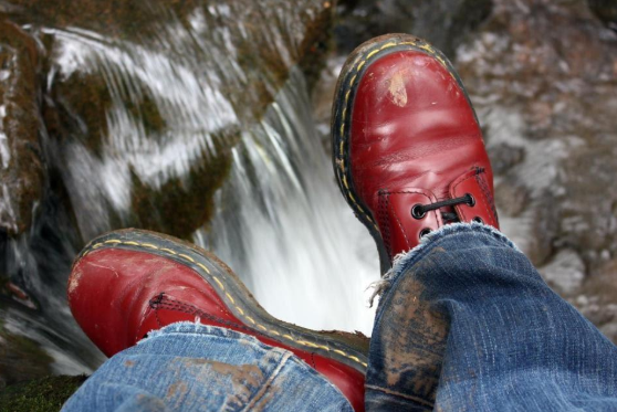 Red boots, water, and jeans.