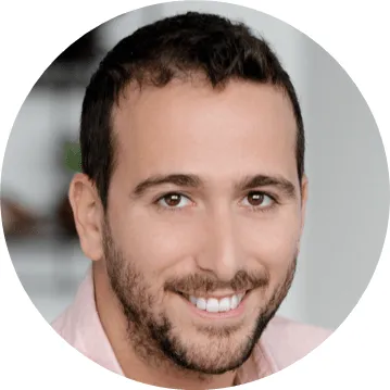 Close-up portrait of a smiling man.