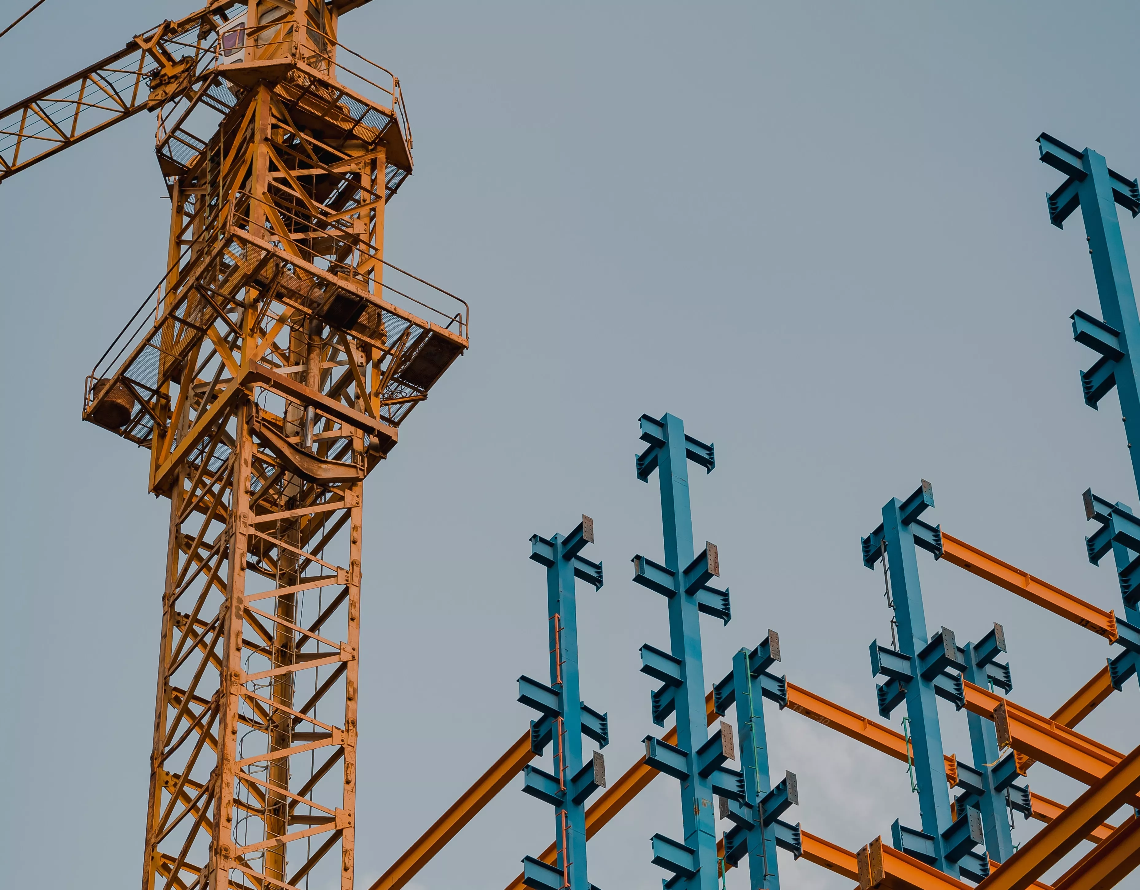 Construction crane and steel beams.