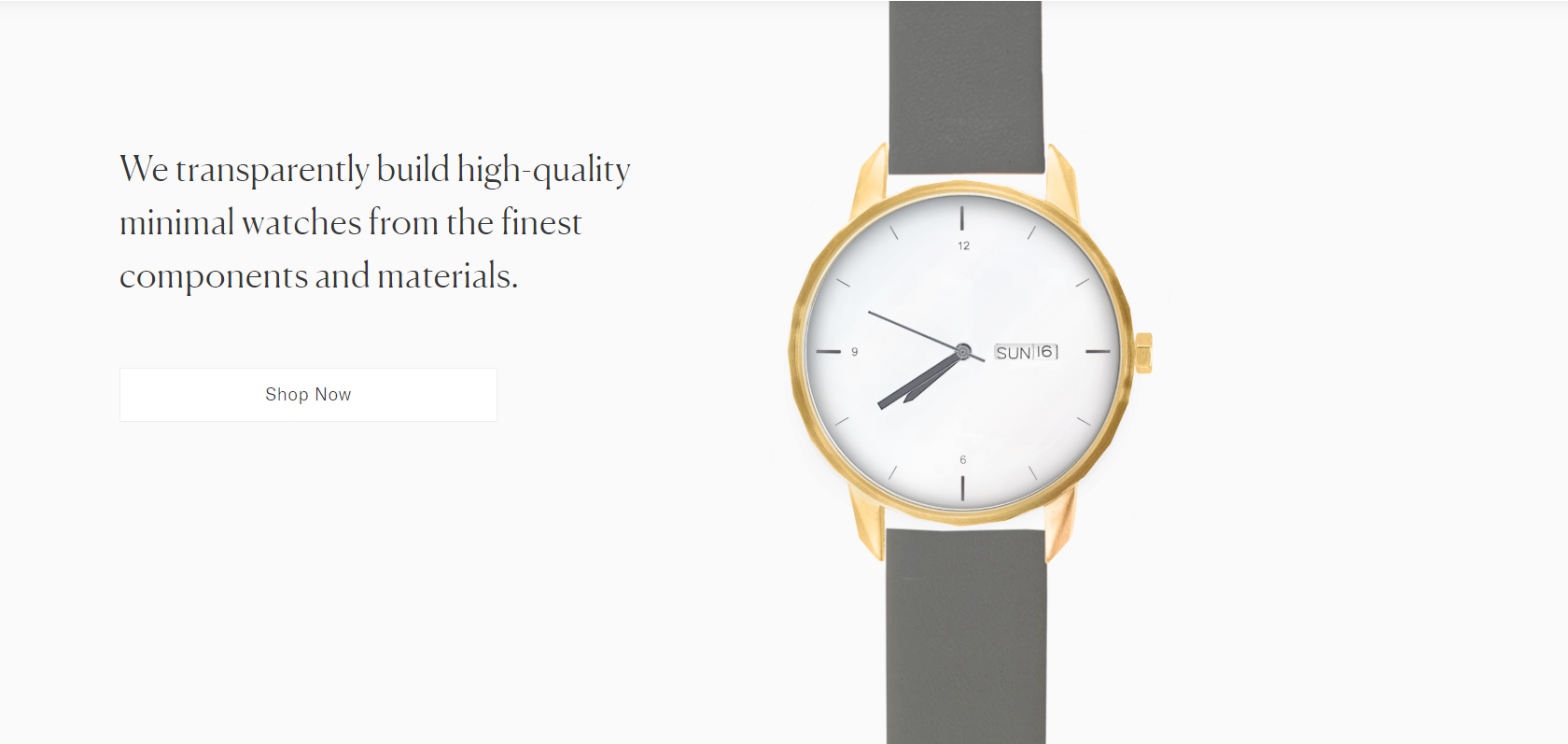 Gold watch with gray band.