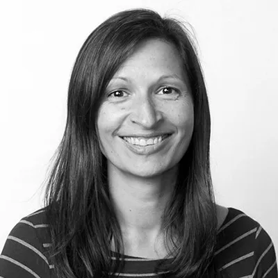 Woman, smiling, feedback advocate.