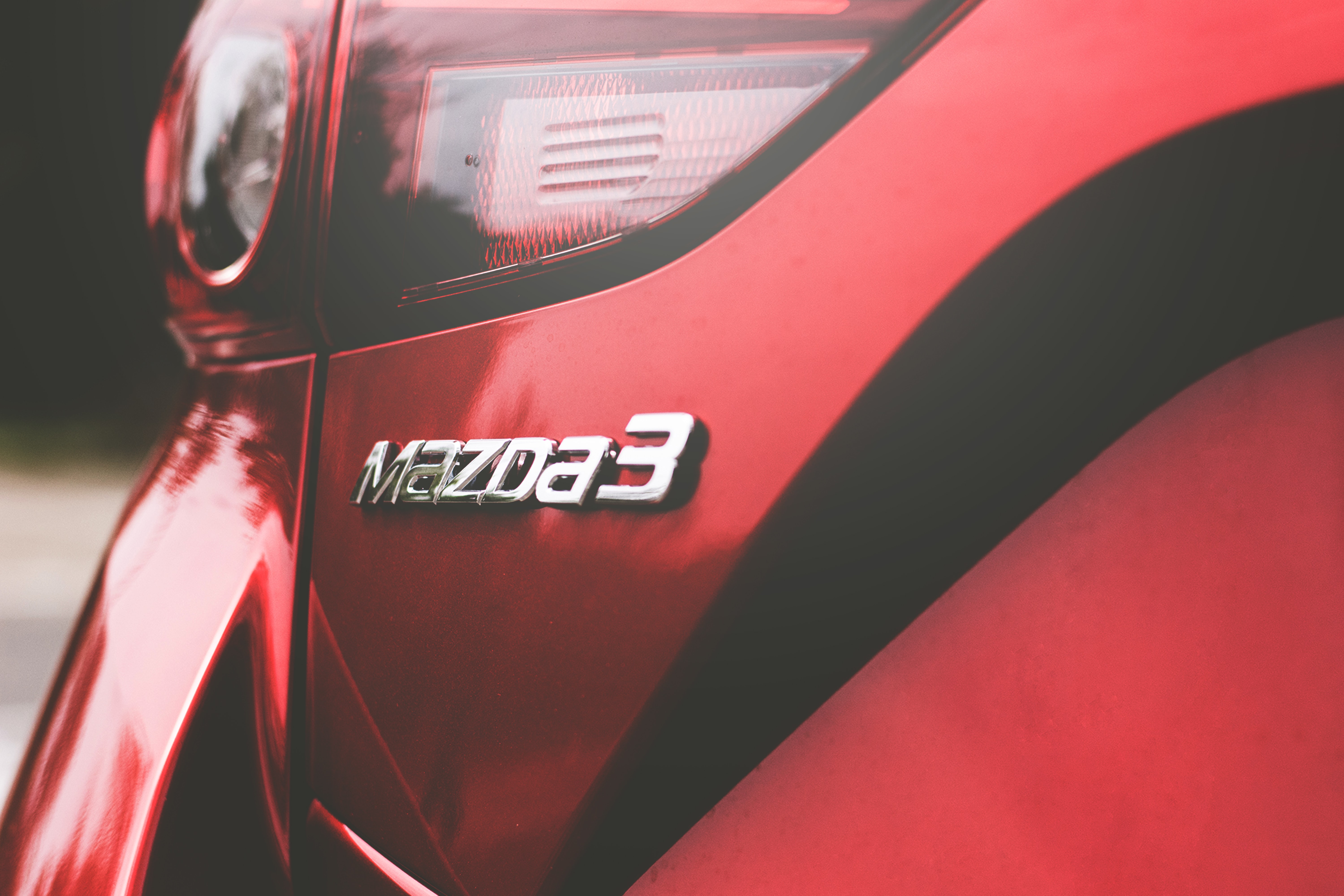 Mazda 3 car, red, logo.