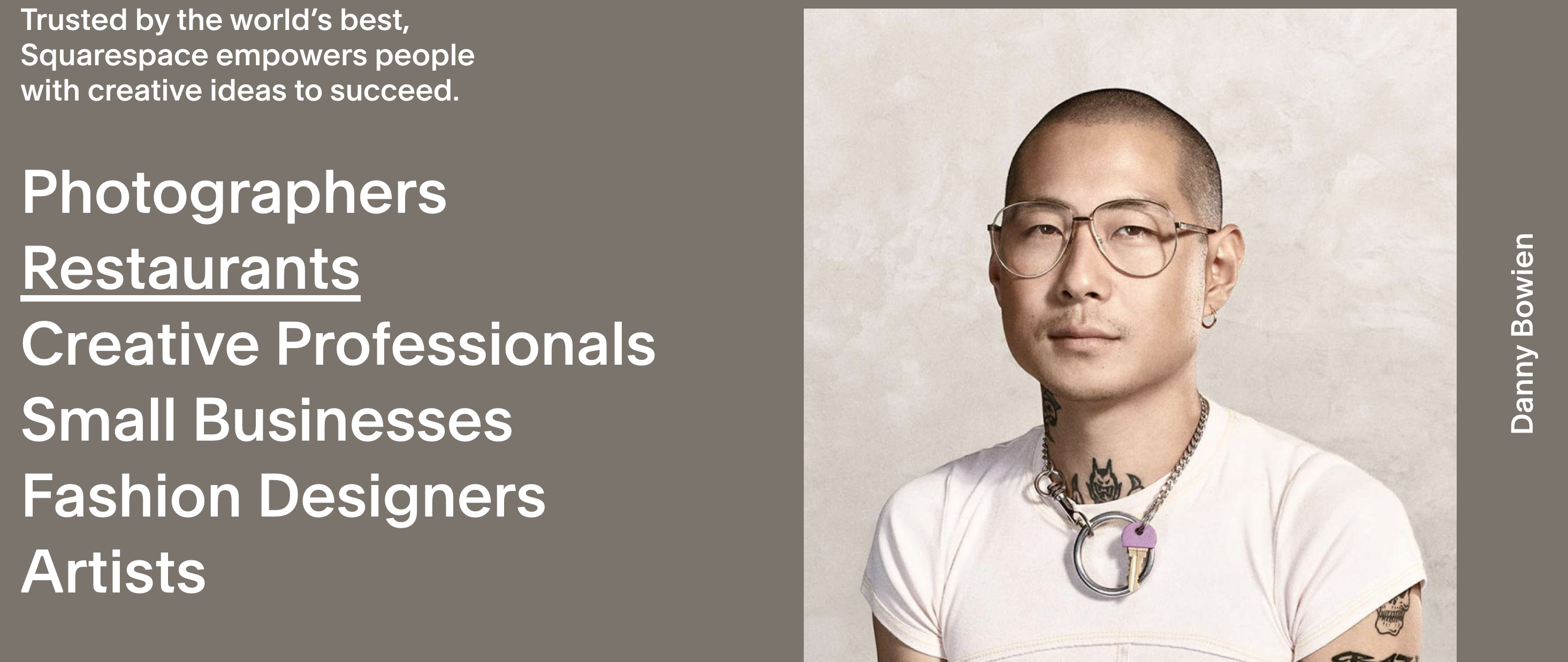 Man with glasses and tattoos.