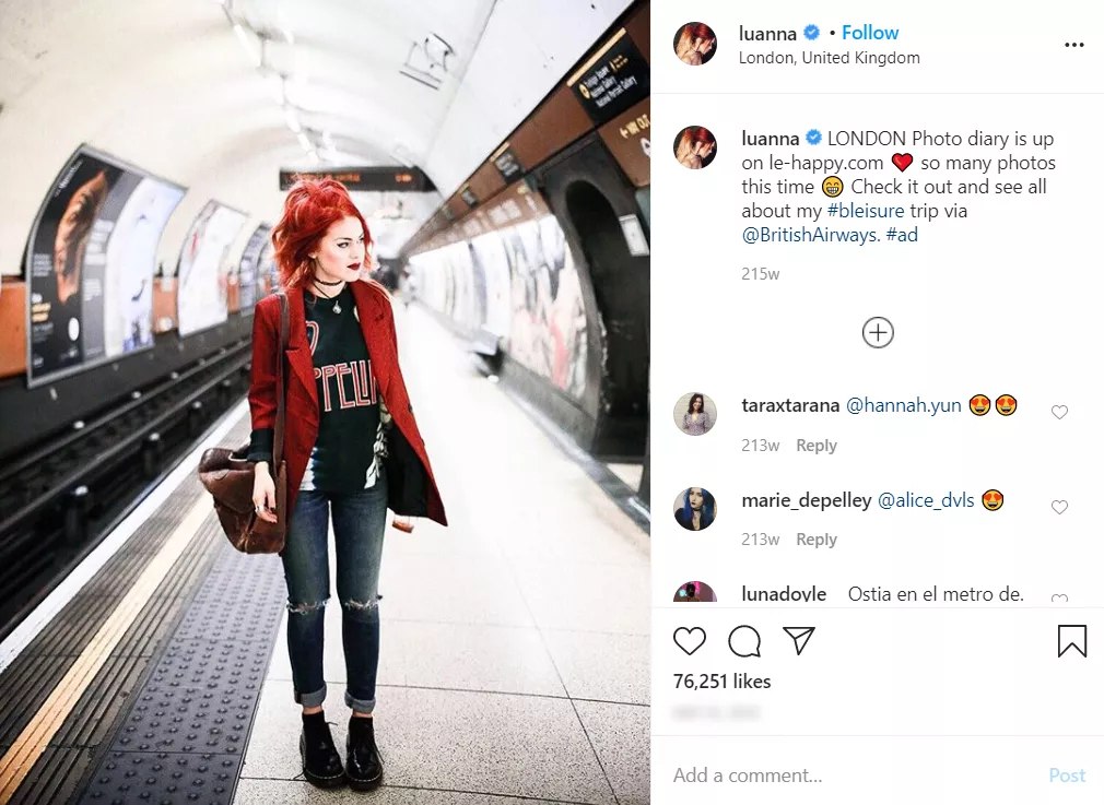 Woman in red blazer London subway.