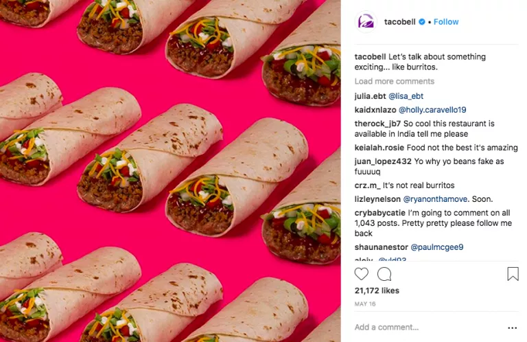 Taco Bell burritos, vibrant pink background.