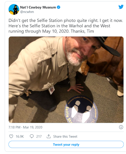 Museum employee at selfie station.