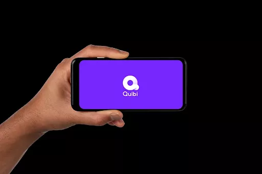 Quibi app screen, purple logo.