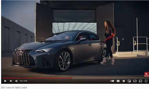 Gray car, woman, luxury vehicle.