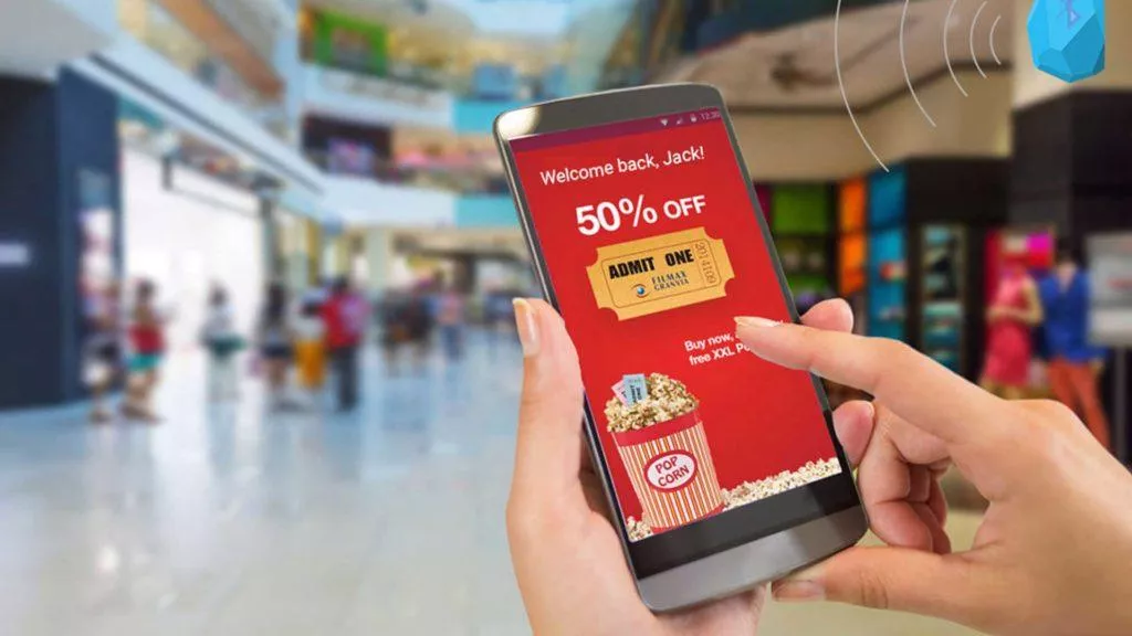 Smartphone showing 50% off movie ticket.