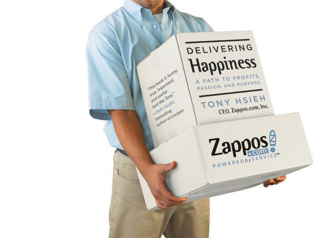 Zappos CEO carrying books. Brand consistency.